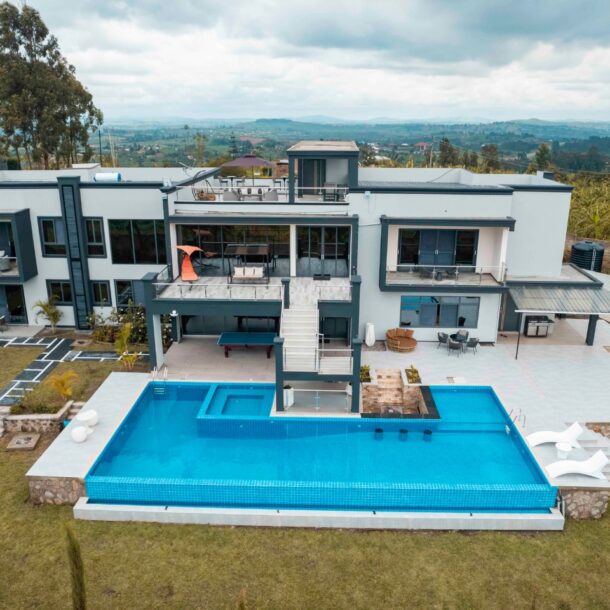 Aerial view of Utoppian Airbnb Mbarara showing the infinity pool and luxury holiday home